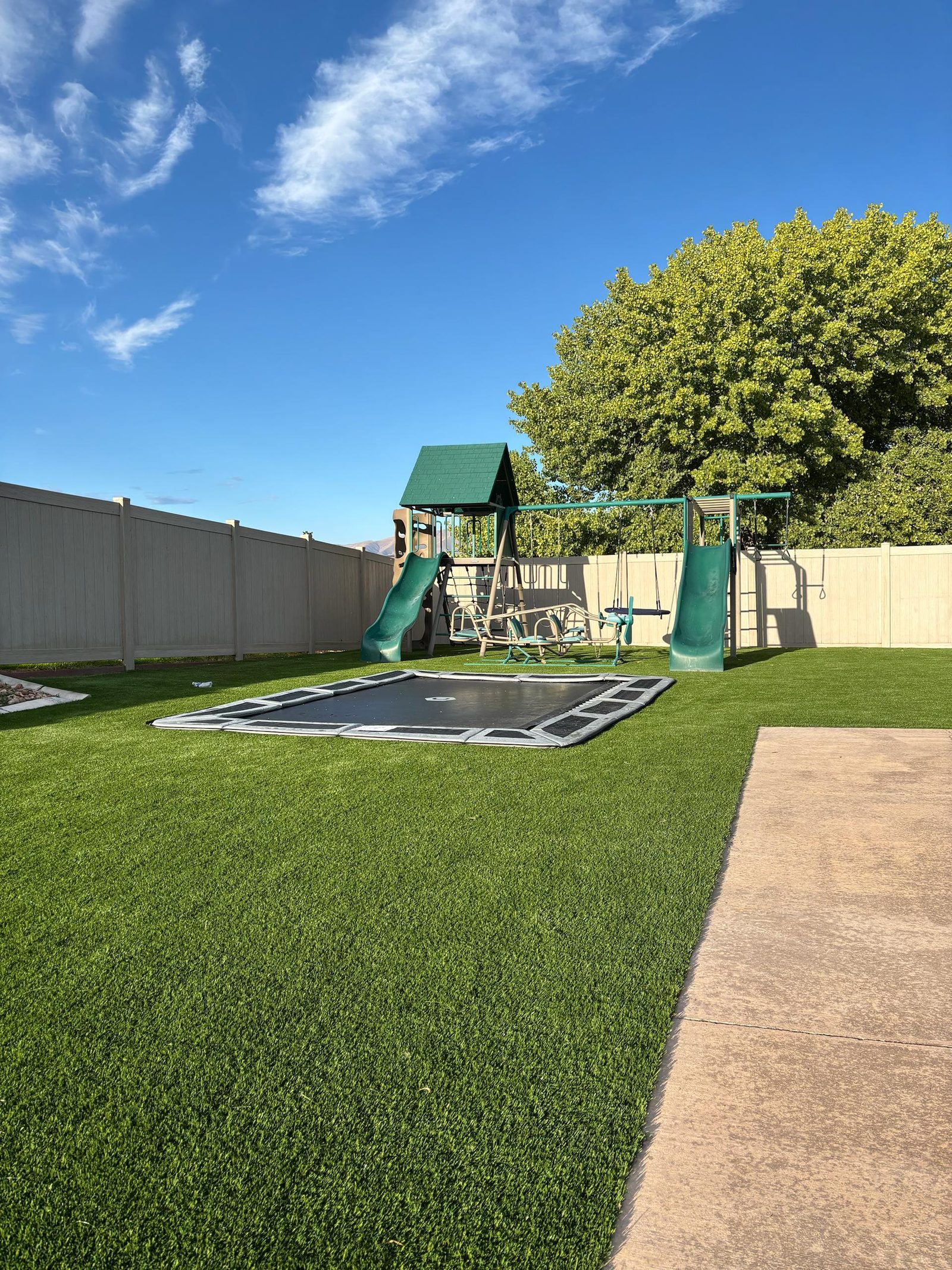 Artificial turf installation in Utah. Backyard play area & swing set