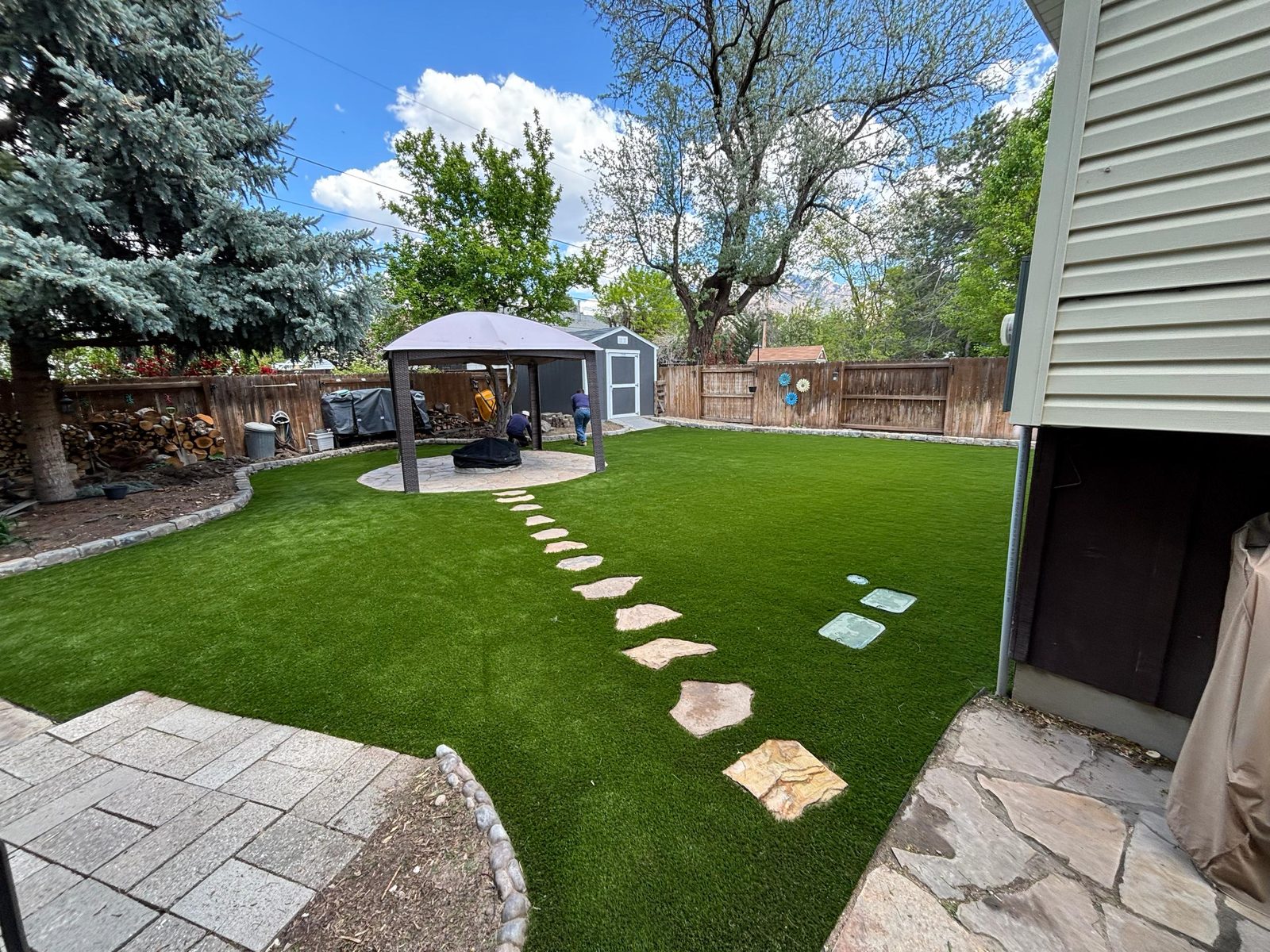 Backyard artificial turf with paver walkway in Utah