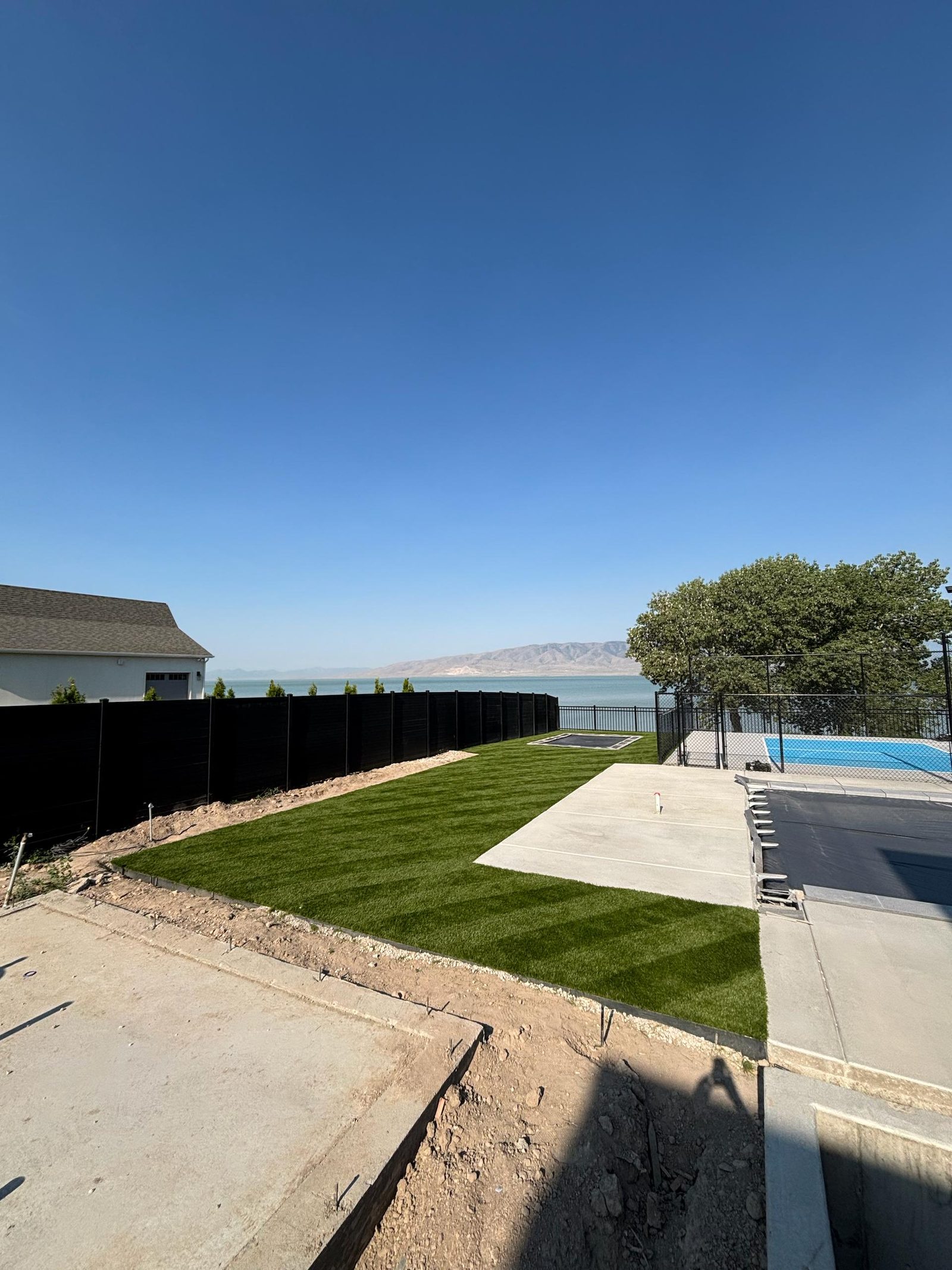 Artificial turf installation in Utah. Backyard lawn with valley views