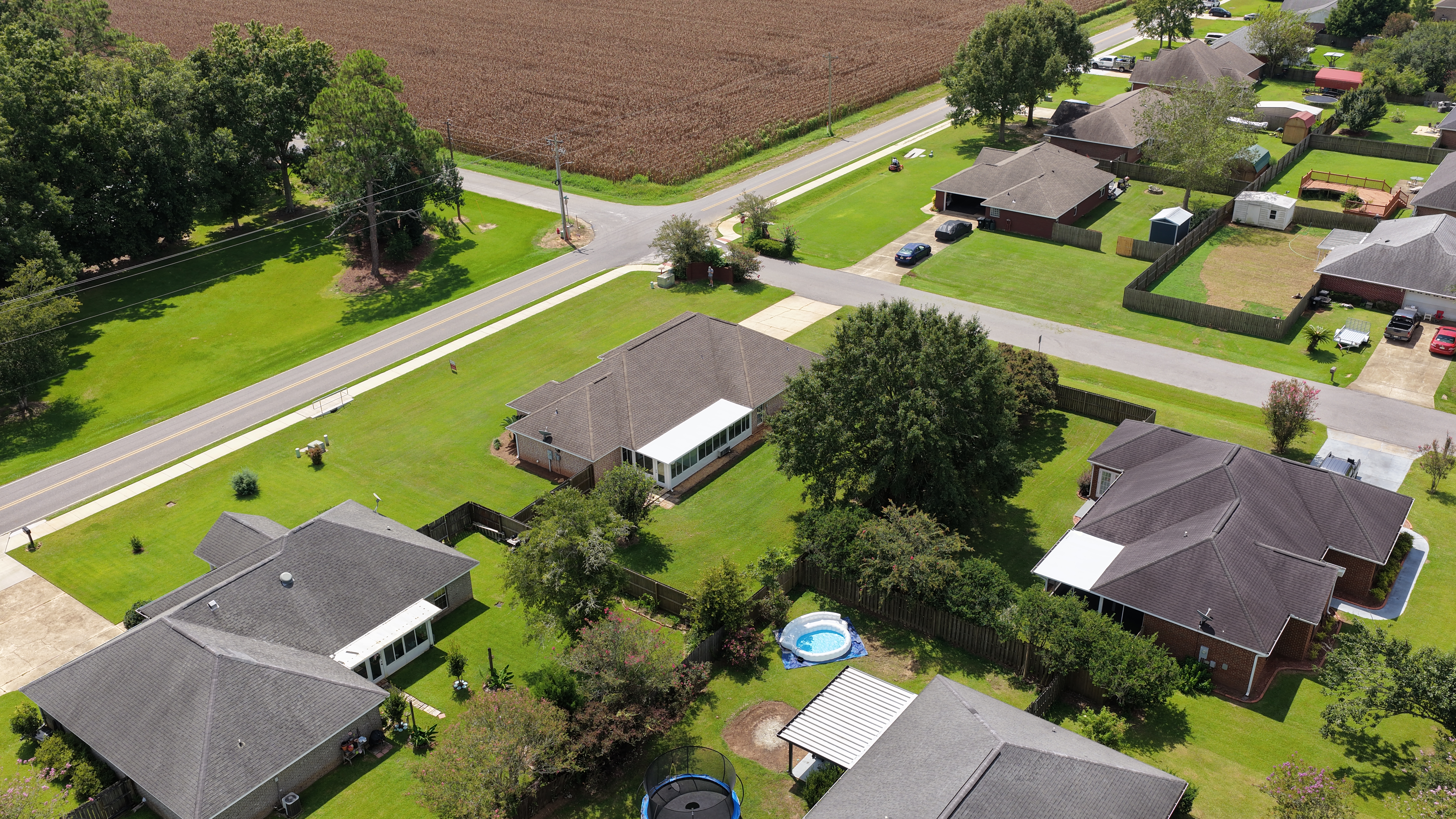 Rear aerial showing sunroom and backyard