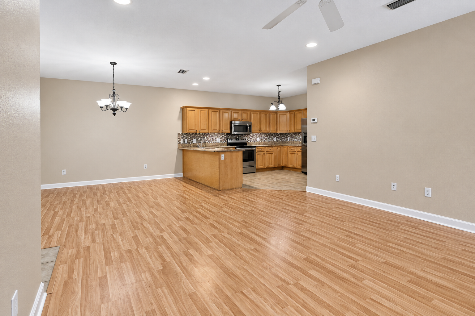 Empty living room with a fireplace in a home in Robertsdale, Alabama