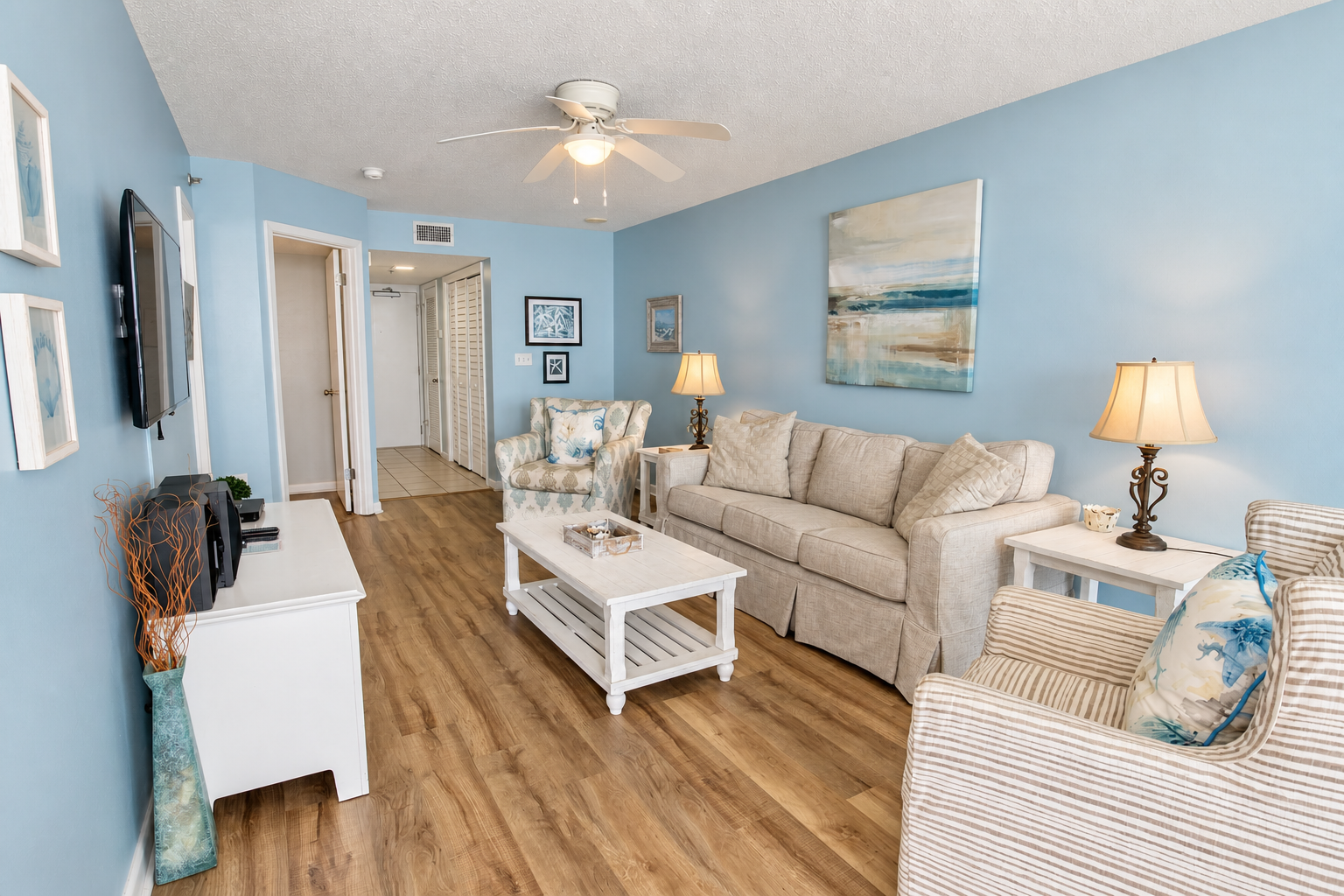 Open living and dining area inside a Phoenix East II condo in Orange Beach, Alabama
