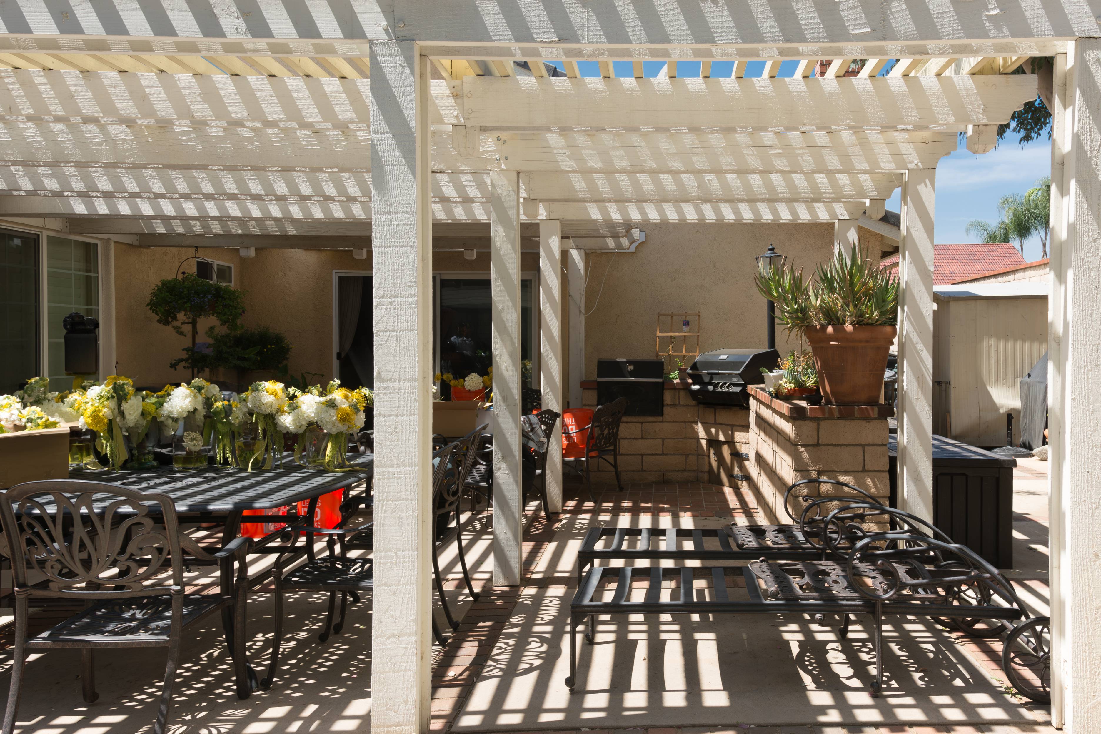 Modern louvered patio cover with adjustable shade control for an Arizona outdoor living area Modern louvered patio cover with adjustable shade control for an Arizona outdoor living area