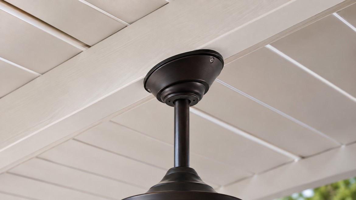 Ceiling fan downrod and canopy mounted to a sloped patio cover beam