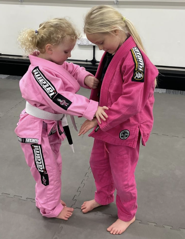 Two girls training Jiu Jitsu