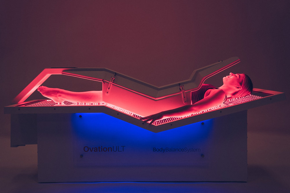 Patient in MI Prime Health OvationULT Red Light Therapy Bed