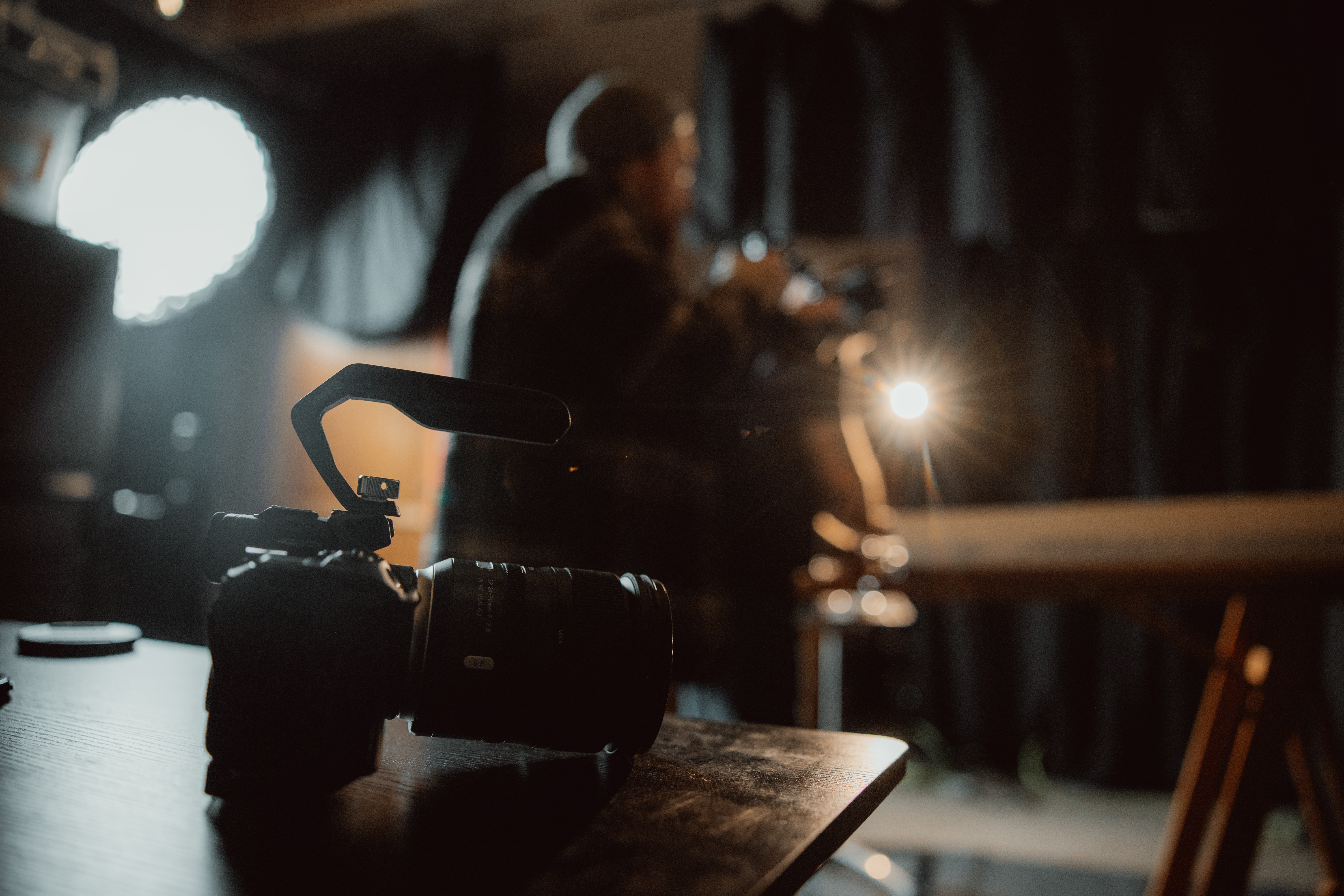 Camera on table while video production cameraman taking shots