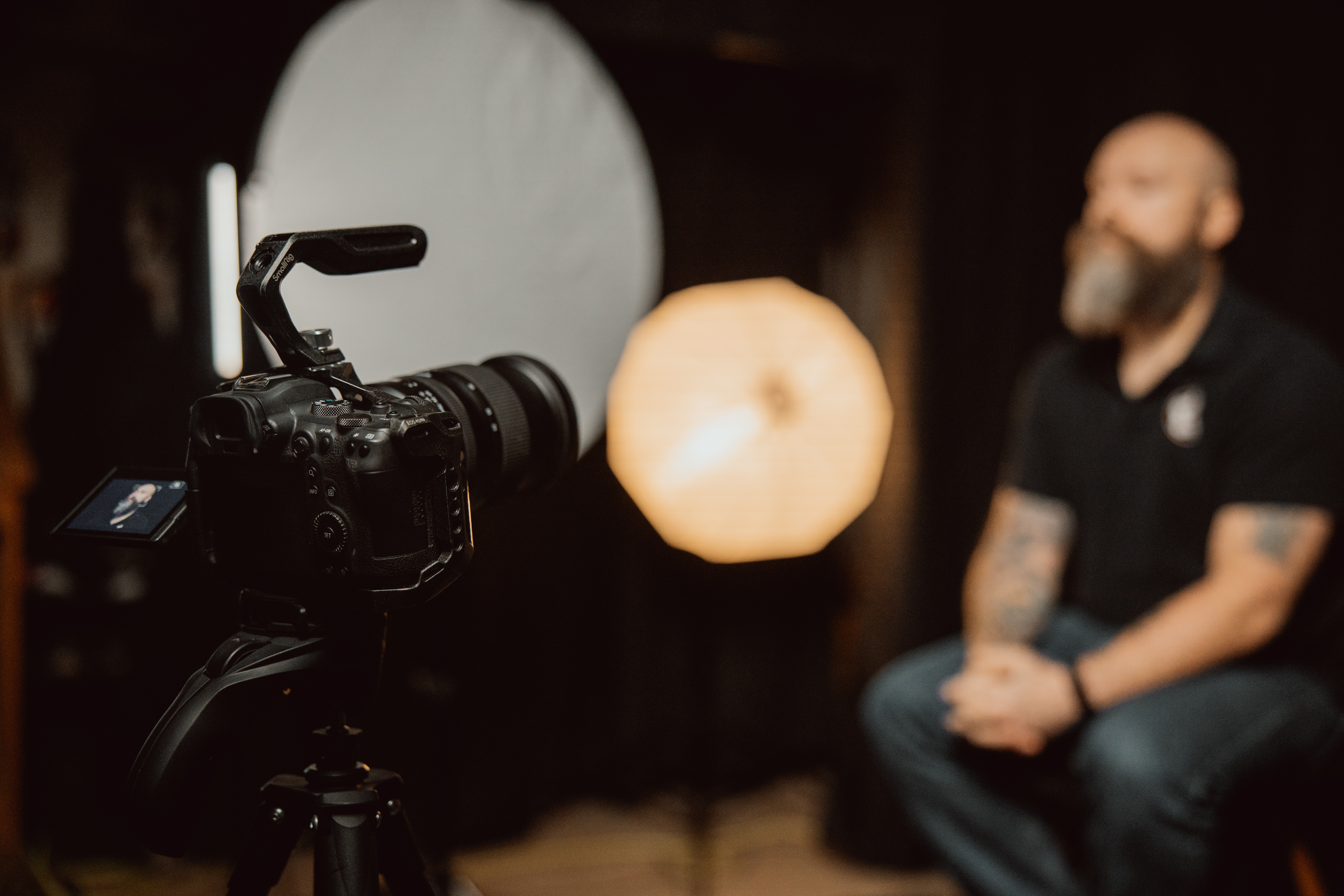 corporate business owner doing headshots with photographer for marketing