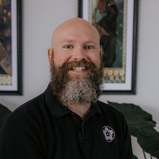 Cory Claussen is a tattoo artist with over 18 years of experience, specializing in Japanese-inspired tattoos, ornamental body suits, traditional tattoos, sleeves, back pieces, and large-scale cover ups. He tattoos at Red Arbor Tattoo near Sioux Falls, South Dakota, and has worked across two continents, three countries, and more than 26 states.