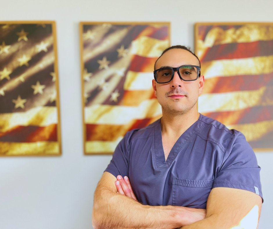 provider standing proud in front of American flag
