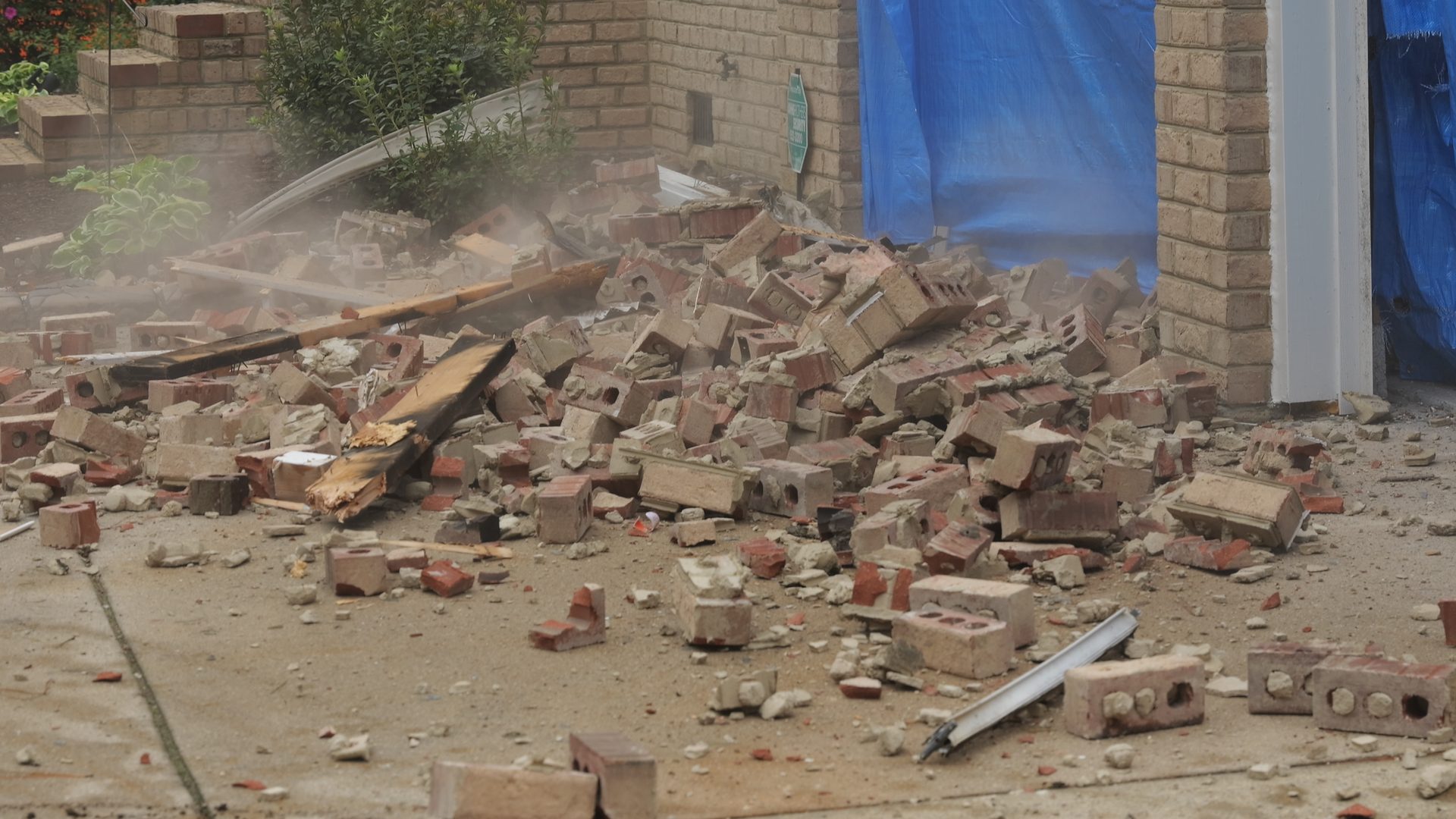 Dust control water spray during a demolition tear-out