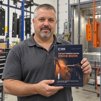The shop manager of a Southern California commercial powder coating operation holding the Price Book