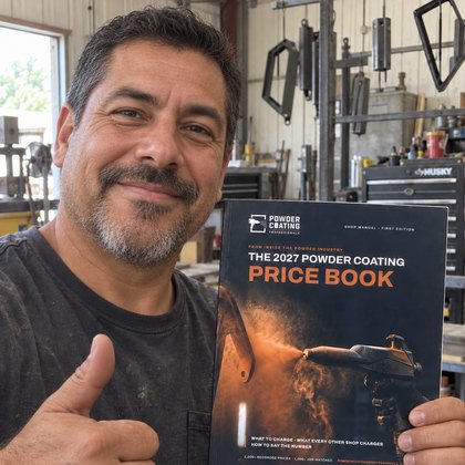 An independent powder coater from rural Oklahoma holding the Price Book in his one-person shop