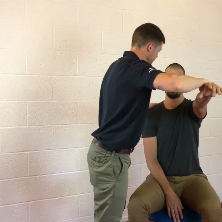 Arm muscle test while screening the jaw