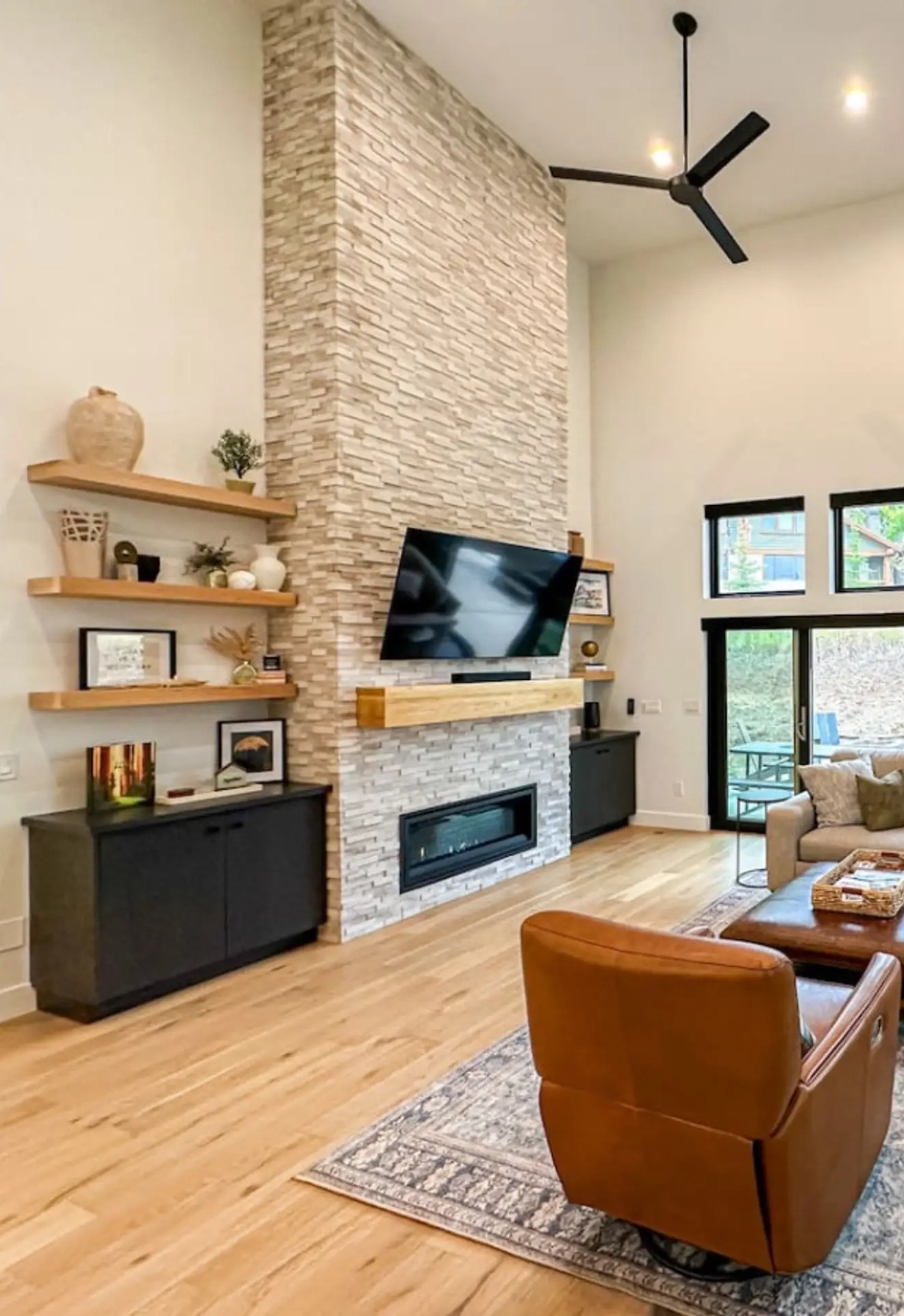 woman setting sheets on bed