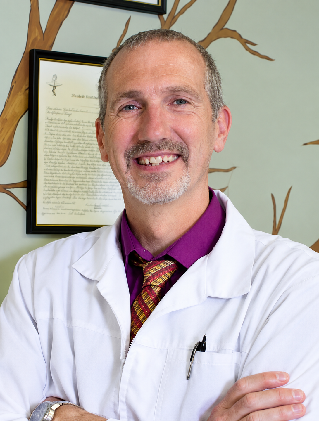 Dr. Robert Sparks in a white lab coat at Sparks Family Chiropractic in Lancaster, Ohio