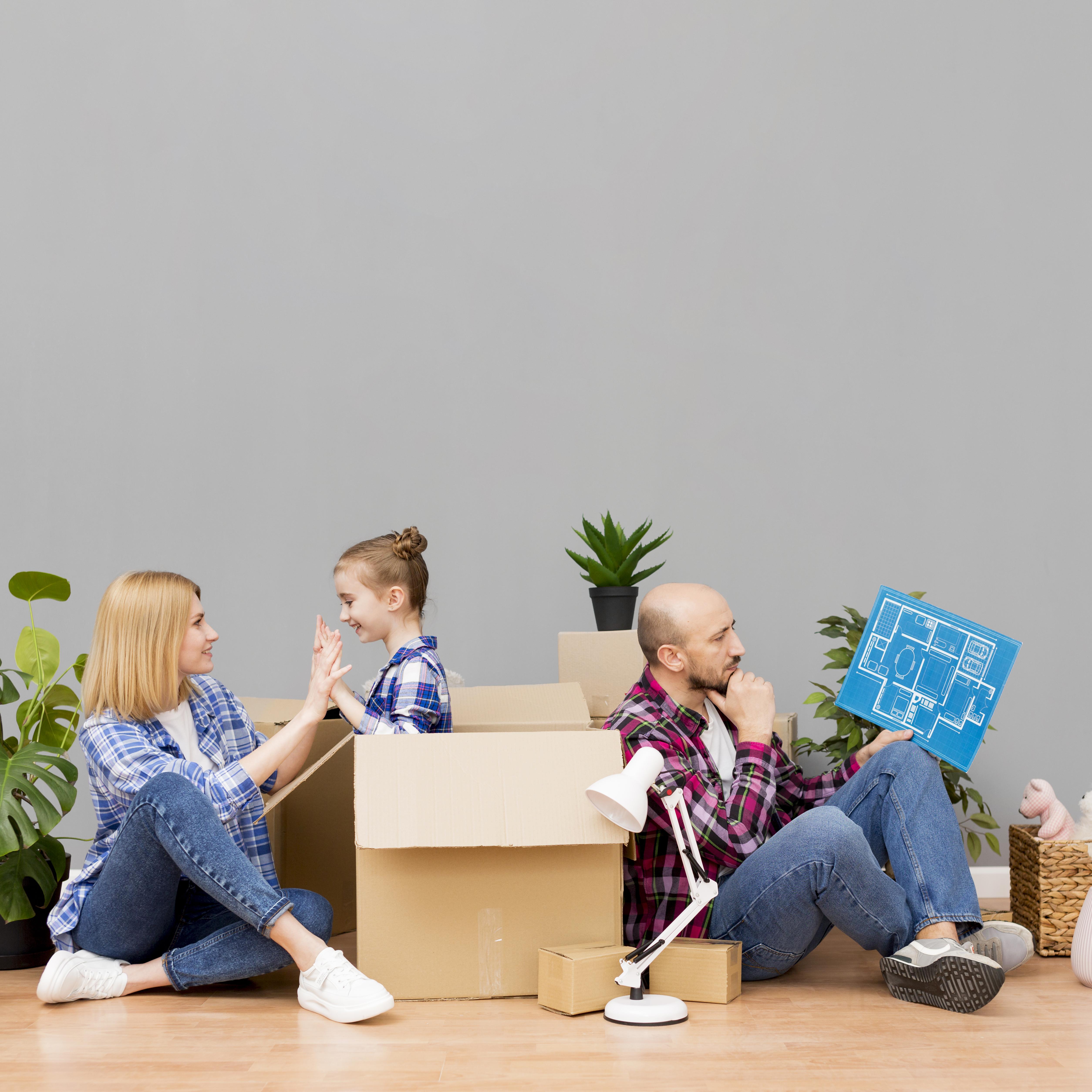 A happy Dallas family in their living room with moving boxes, representing the peace of mind a 2026 temporary occupancy agreement provides. A happy Dallas family in their living room with moving boxes, representing the peace of mind a 2026 temporary occupancy agreement provides.