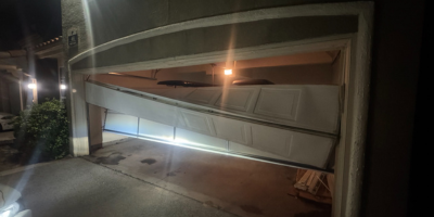 Damaged Garage Door Before Repair