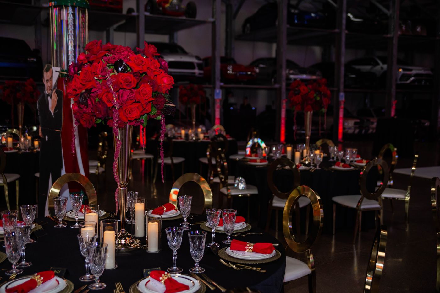 Black, red and gold tables at a James Bond themed birthday