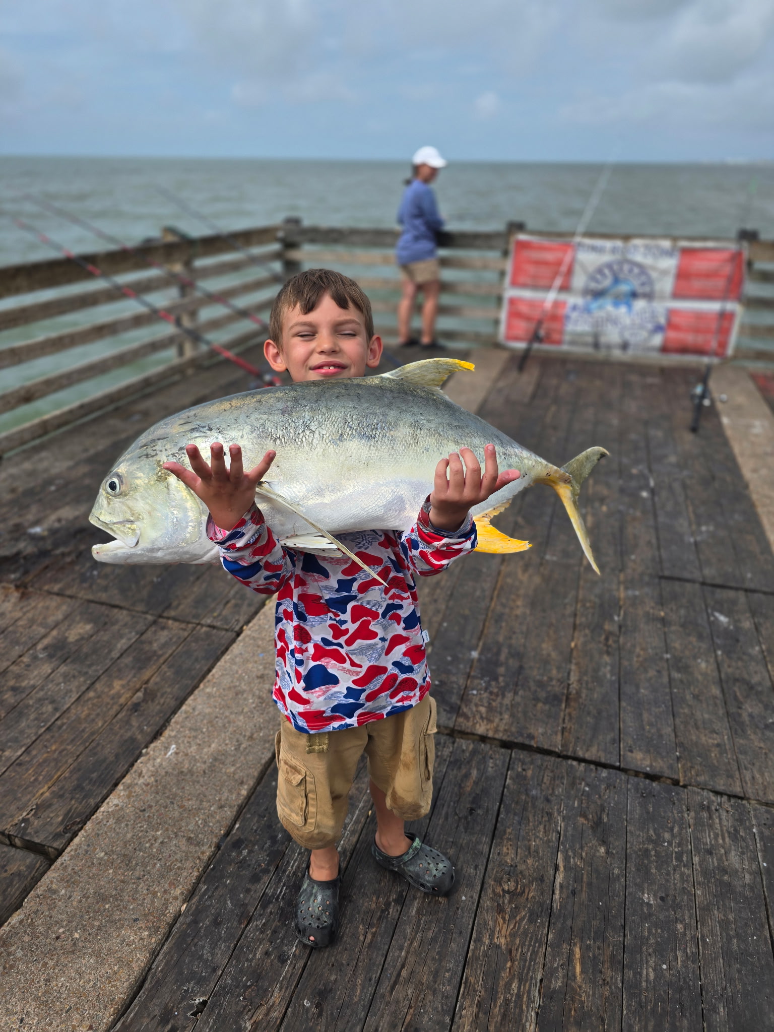 Kids learning to fish on the pier