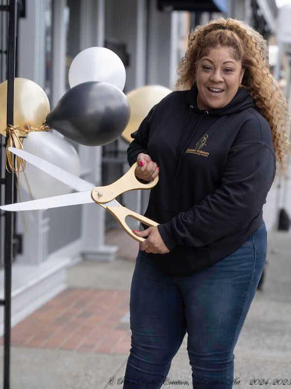 HTFFSP team member cutting the ribbon at a community opening in Tacoma