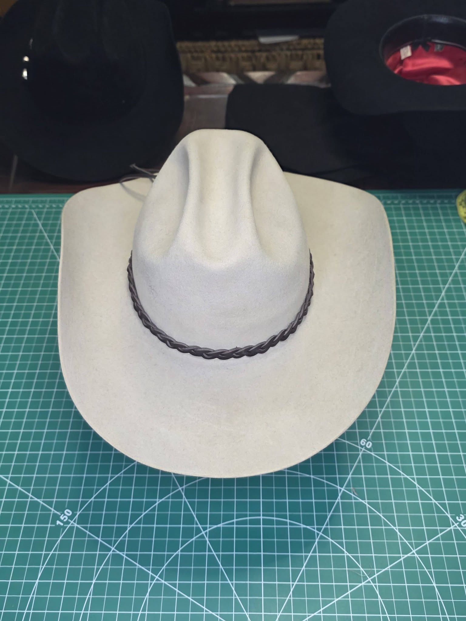 Hand-shaped cowboy hat by Charred Barrel Hattery