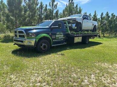 Moffo's Towing and Repair tow truck on site during a service call