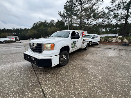 Moffo's Towing truck hauling a camper for recovery service