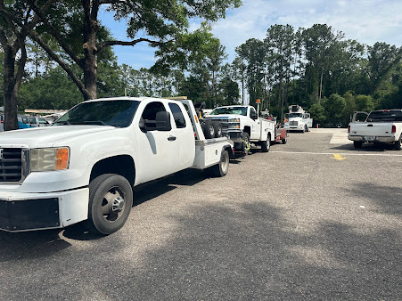 Moffo's Towing crew member securing a vehicle for transport