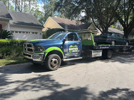 Moffo's Towing rollback truck parked at a roadside service call