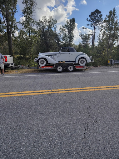 Moffo's Towing and Repair truck parked at the shop in Lake City