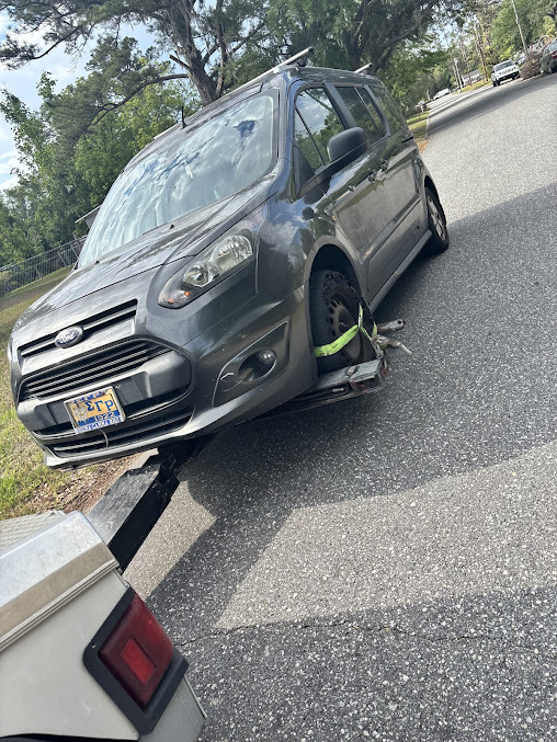 Moffo's Towing driver preparing equipment before a job