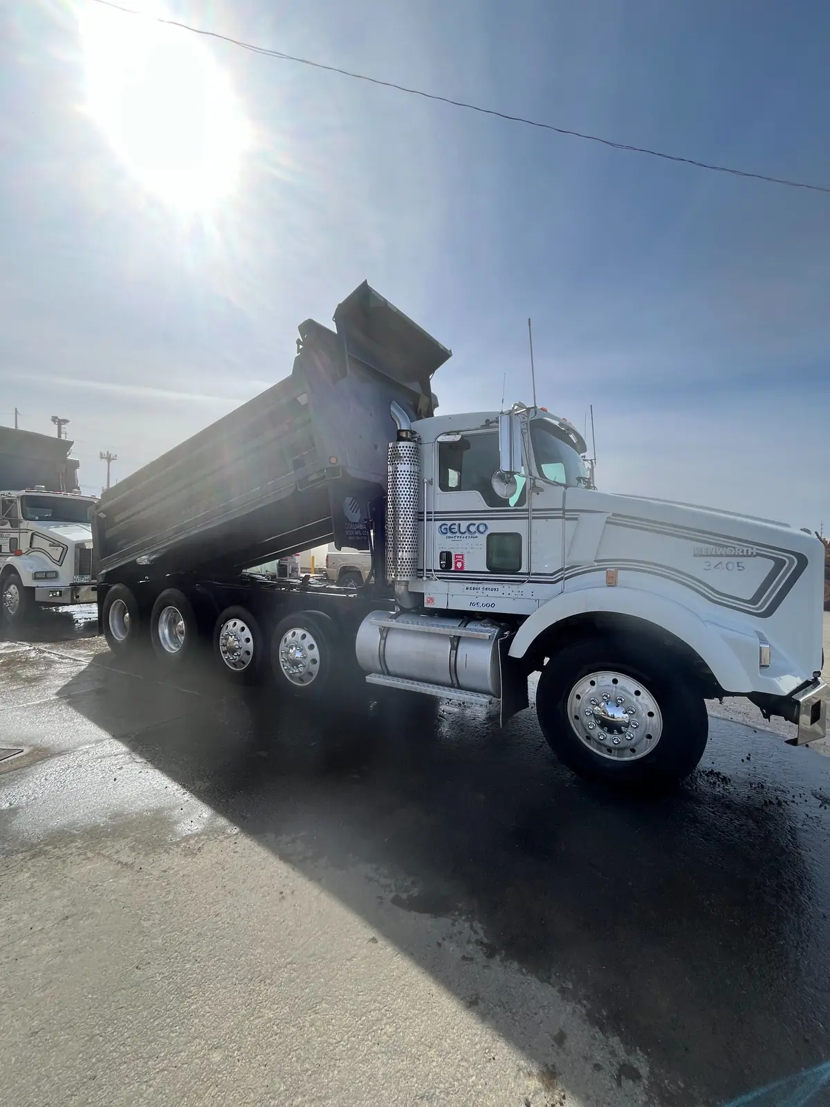 After: White dump truck exterior washing before and after in Salem, OR