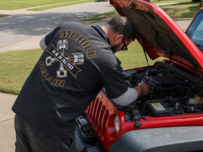 Mobile mechanic working on engine performance tune up in Northwest Arkansas