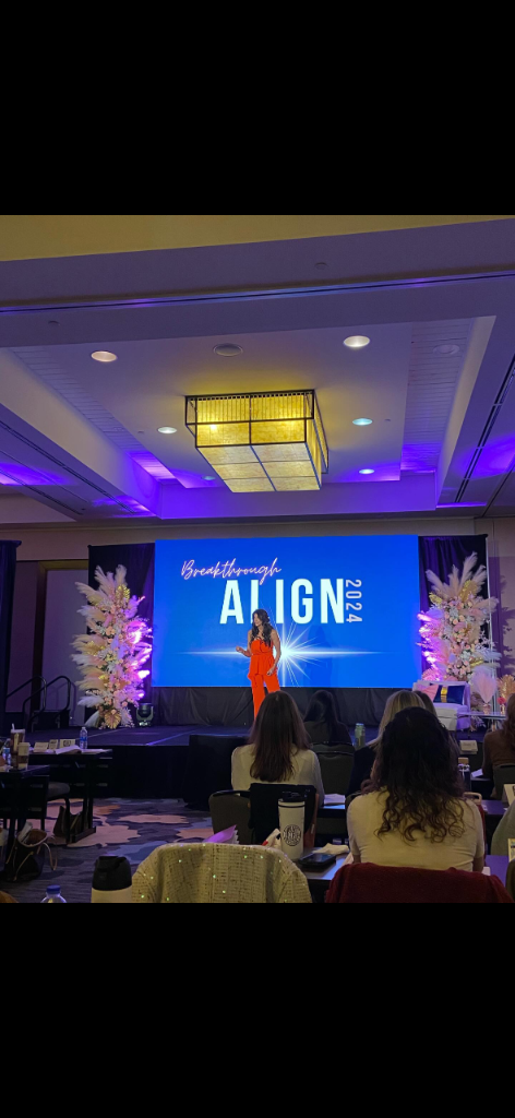 Leah Roling speaking on stage at an event
