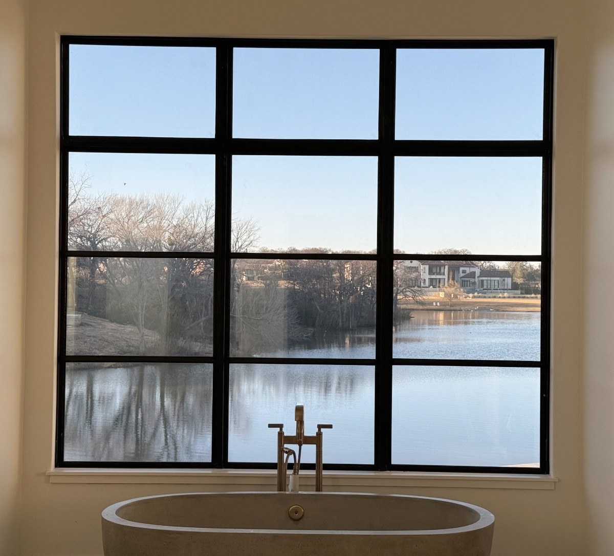 A bathroom window with Deluxe Smart Film, switched on and clear