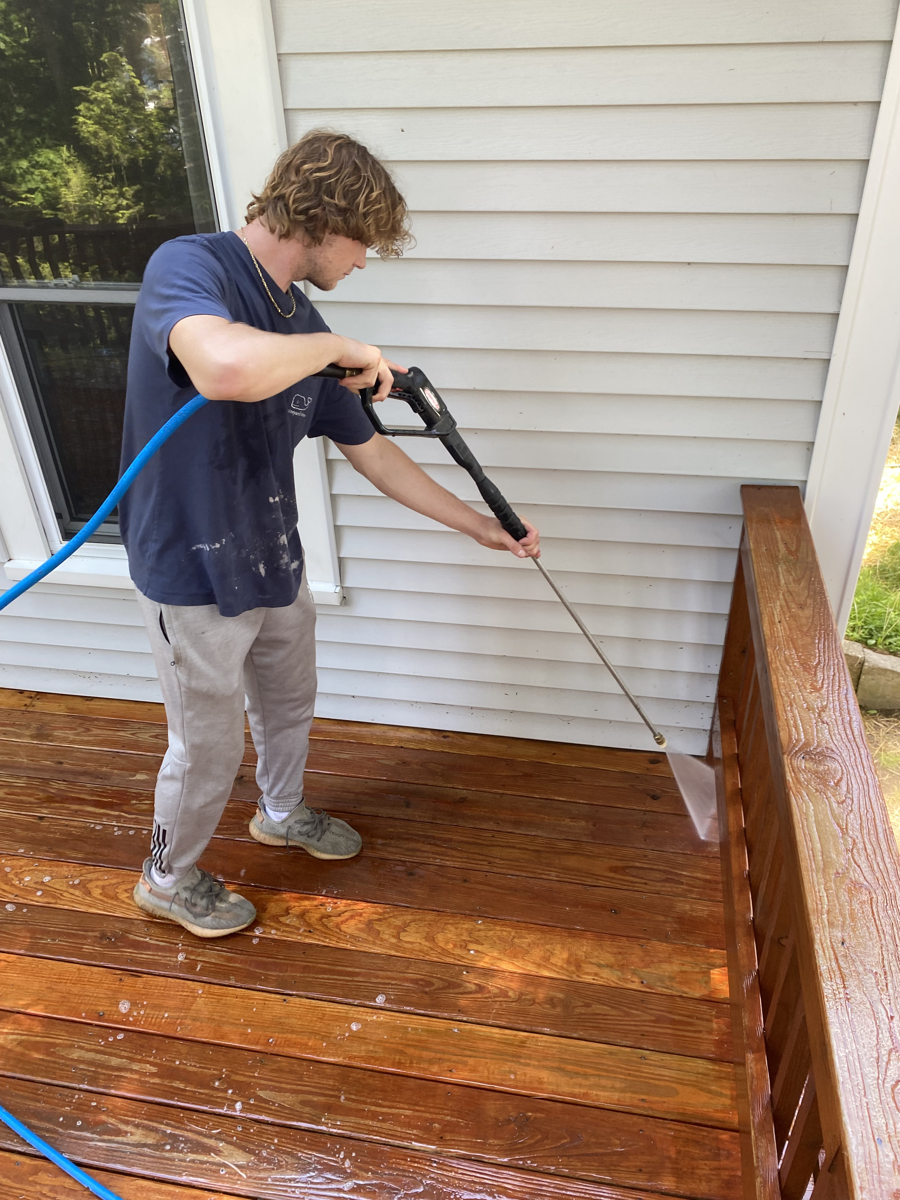 Professional pressure washing a home exterior in Dover NH