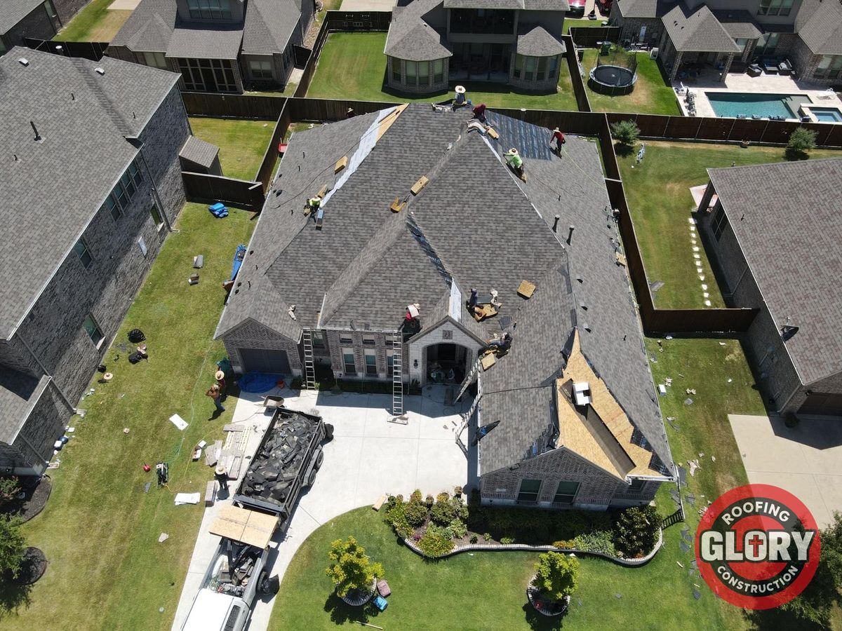 Aerial view of a Roofing Glory crew replacing a roof