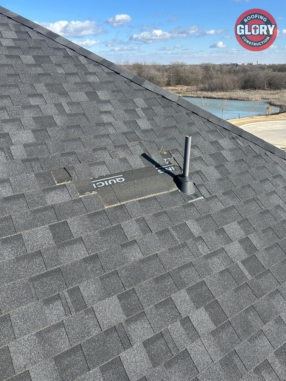 Missing shingles next to a roof vent pipe