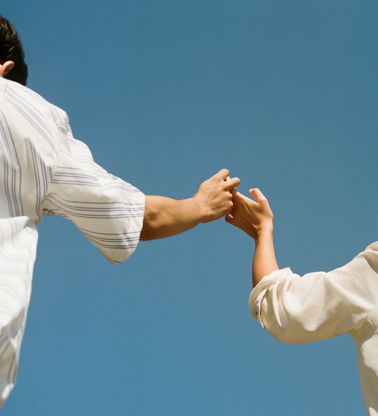 The handoff — two hands connecting