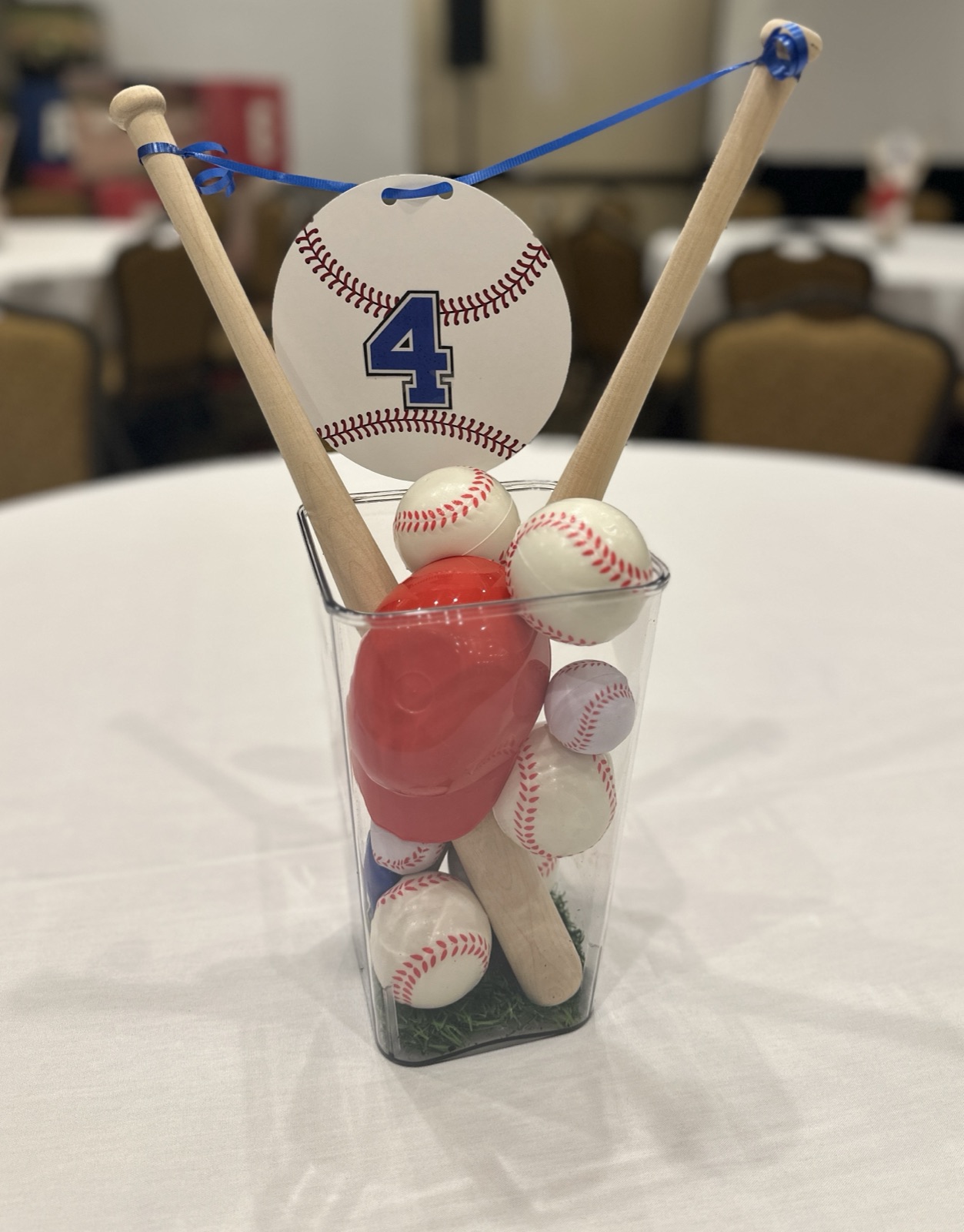 OE Team Day baseball-themed table centerpiece detail with mini bats and baseballs