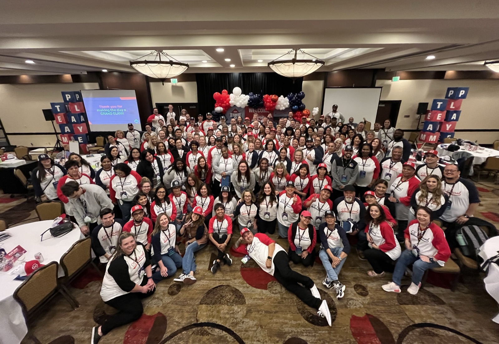 OE Federal team group photo at OE Team Day, everyone wearing matching jerseys