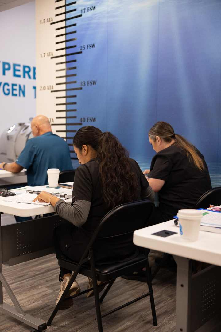 Students studying in the hyperbaric certification classroom