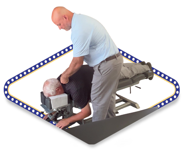Dr. Dale Kimberlin performing an arthrostim technique for a patient dealing with an auto accident injury at Kimberlin Chiropractic located in Ankeny Iowa.