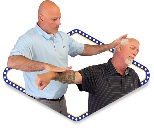 Dr. Dale testing the muscle response for a male patient who had a sports injury in Ankeny IA