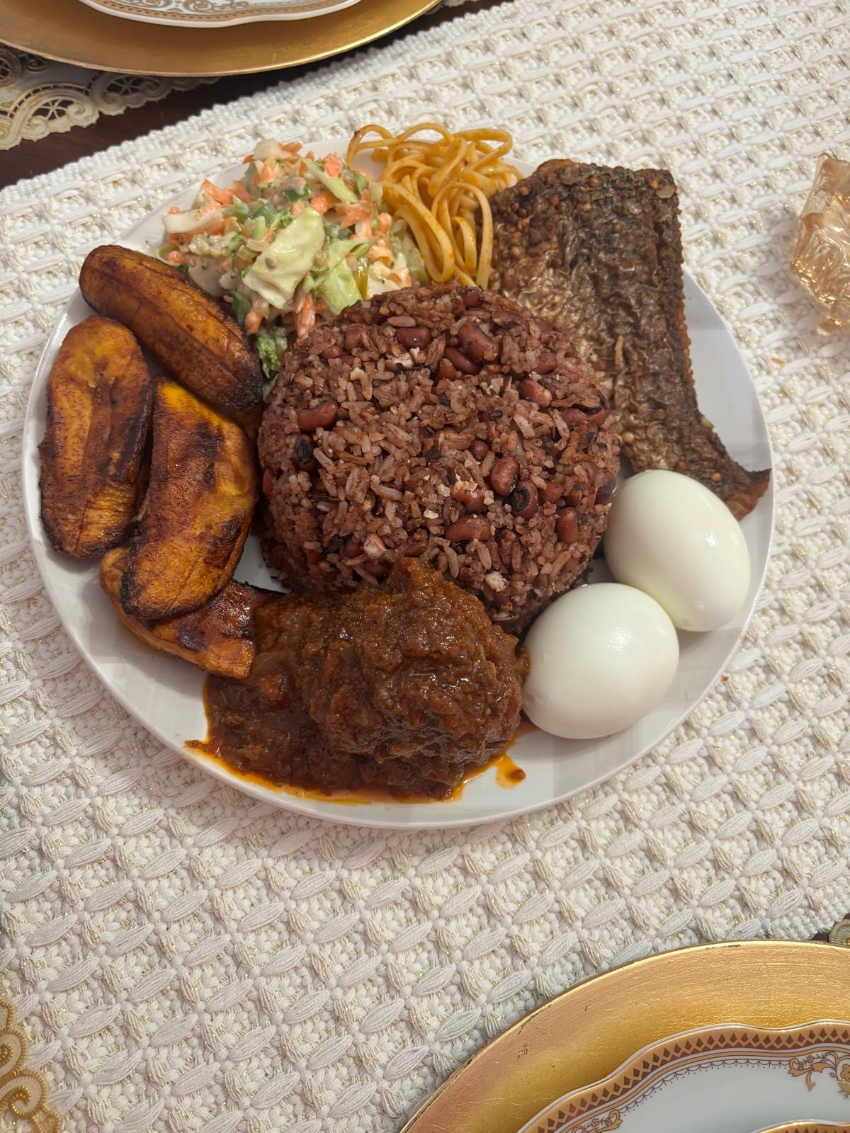 Waakye – Authentic Ghanaian rice and beans with fish, plantains, and eggs