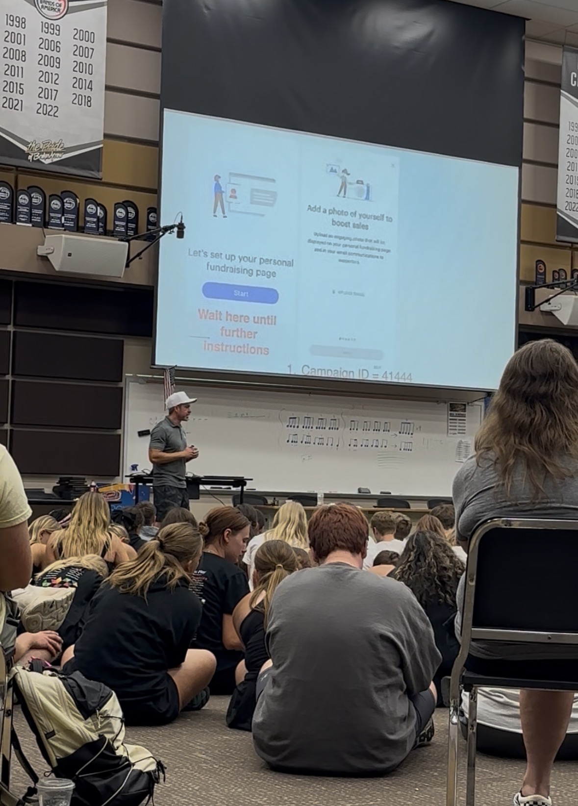 Kyle leading a live band kickoff presentation