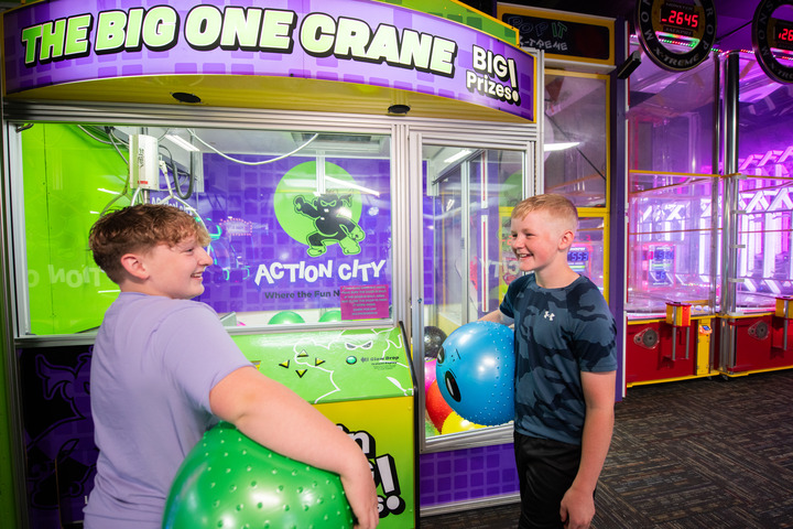 Kids playing in Action City's arcade
