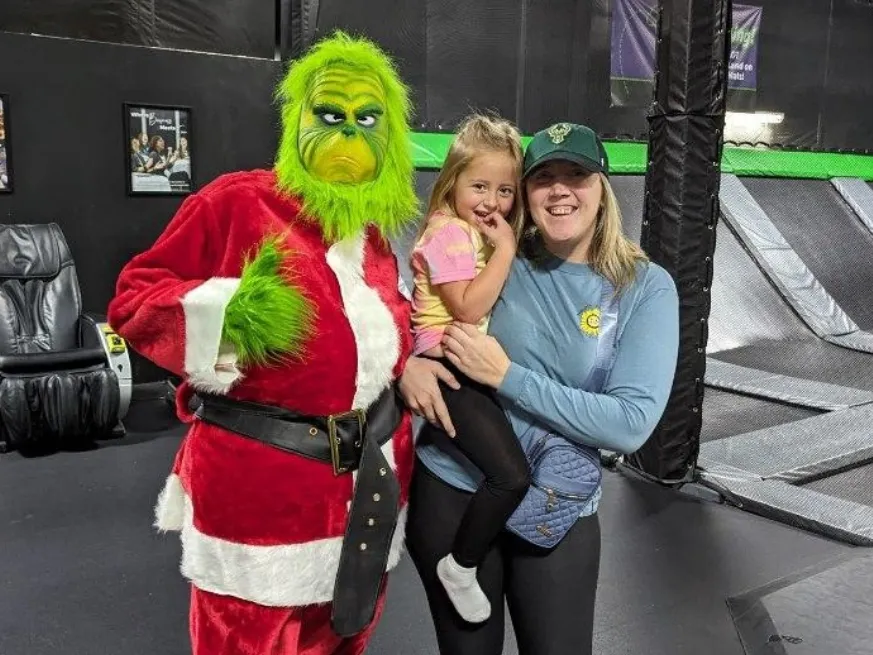A family with the Grinch at Metropolis Resort