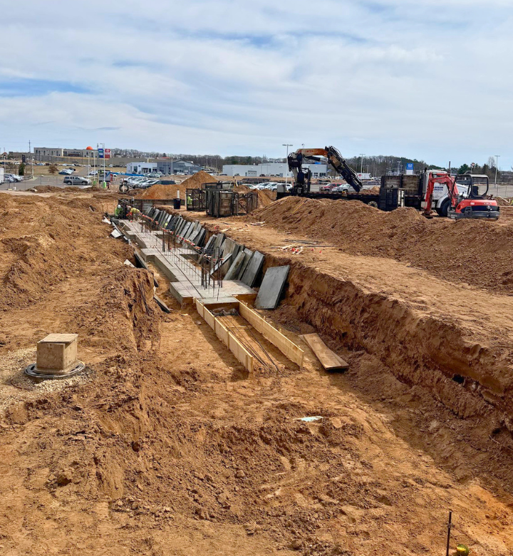 Foundation and cement being poured on the new expansion building at Action City in Eau Claire, WI. Foundation and cement being poured on the new expansion building at Action City in Eau Claire, WI.